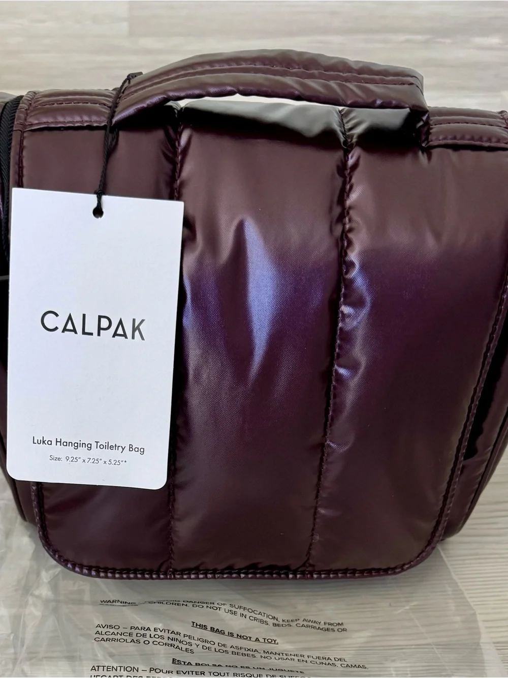 Calpak Luka Hanging Toiletry Bag in Glazed Dark Cherry!